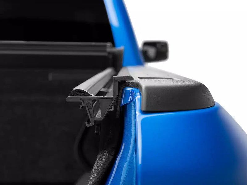 Close-up of the Ultra Flex front corner bracket where the cover rail meets the bulkhead cap.