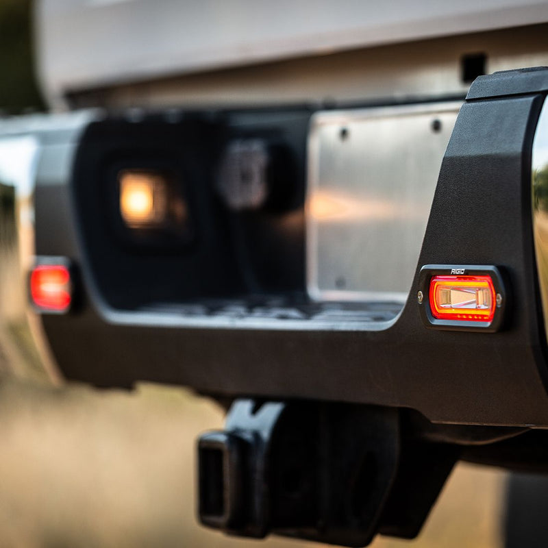 Rigid SR-L Series Spreader Flush Mount with red halo lit in a rear bumper