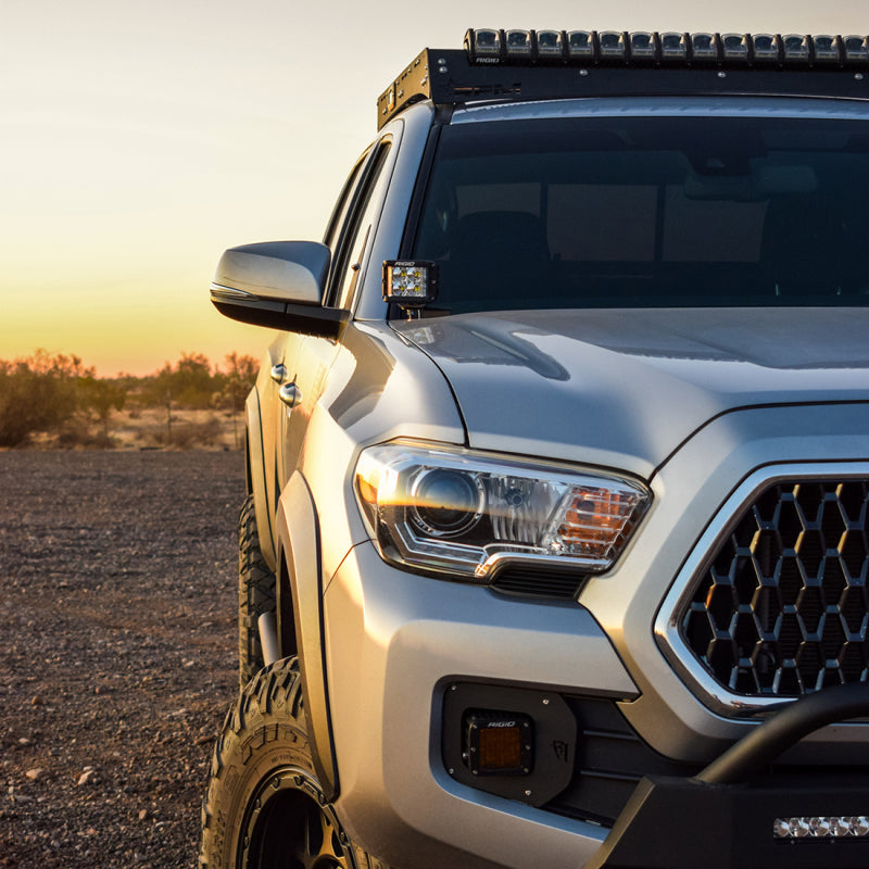 Rigid D-SS Flood A-Pillar Light Kit installed on a silver Toyota Tacoma at sunset