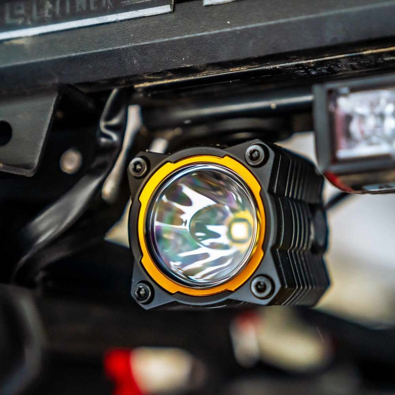 KC HiLiTES FLEX ERA 1 Bezel Ring, FLEX ERA 1 with a gold bezel ring mounted on a vehicle