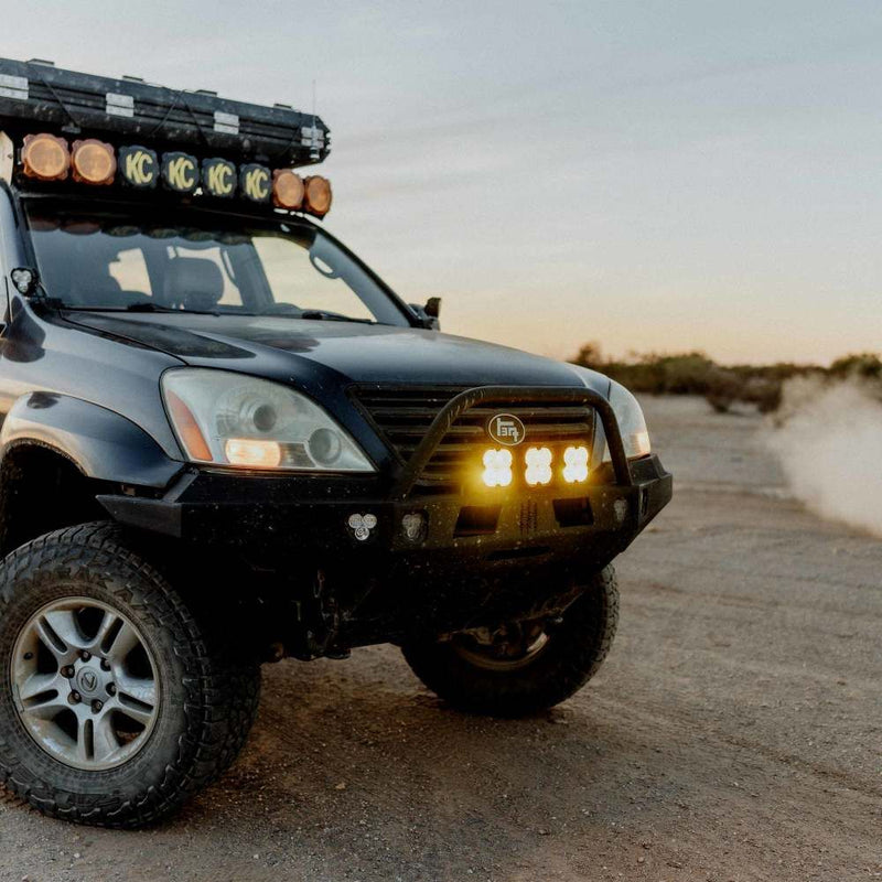 KC HiLiTES FLEX ERA 4 Performance Yellow Lens, SUV at dusk with performance yellow FLEX ERA 4 lights
