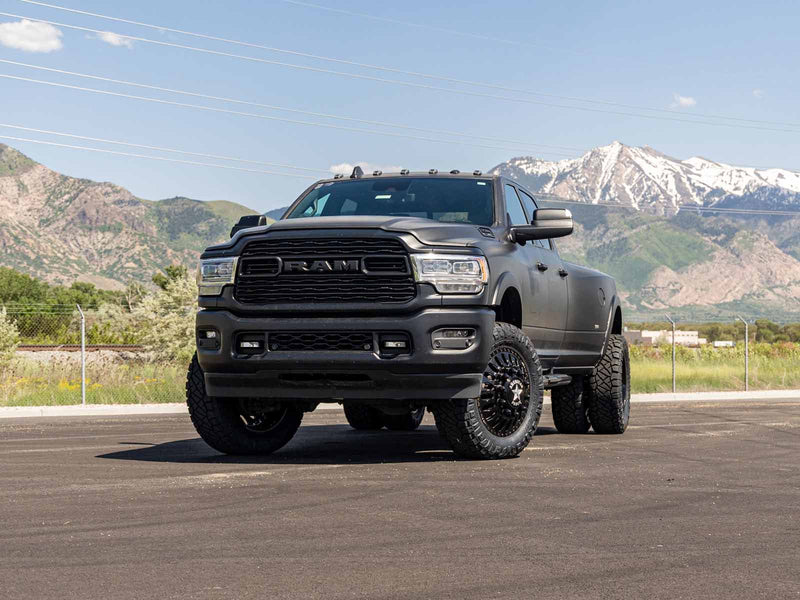 ReadyLIFT 3" Coil Lift Kit With Radius Arm Drop Brackets installed on a black 2019+ Ram 3500 dually, front three-quarter view