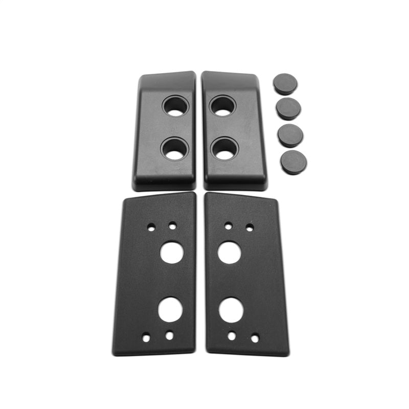 Rigid Roof Line Mount Kit hardware: mounting plates and caps on white
