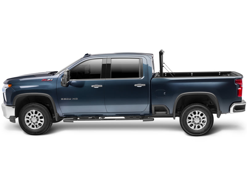 UnderCover Flex hard folding tonneau cover folded fully open and stacked upright at the bulkhead, full side profile view.