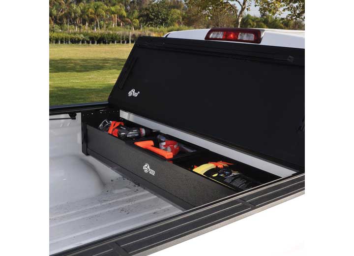 BAK BAKBox 2 open at the bulkhead holding power tools inside a pickup bed