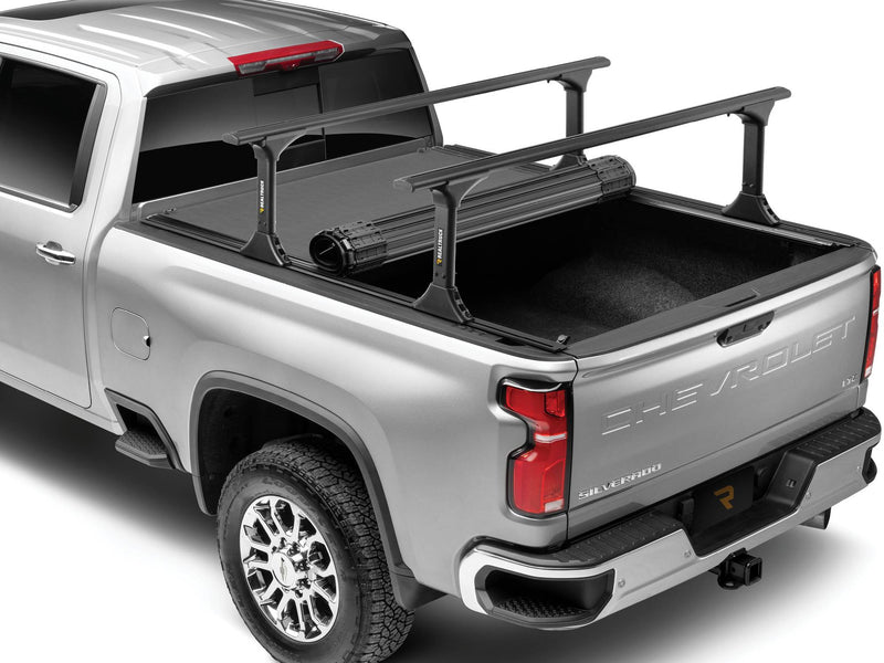 BAK Revolver X4 TS hard roll-up tonneau cover closed with a T-slot bed rack mounted over it