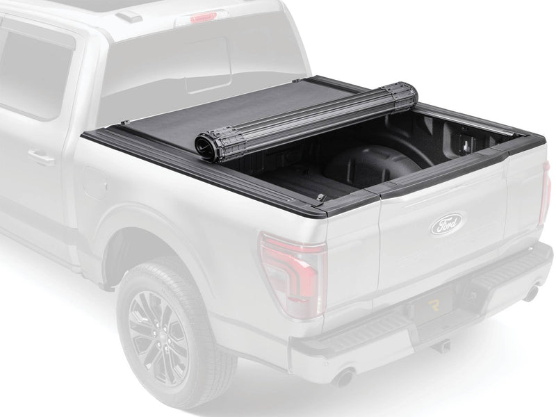 BAK Revolver X4s hard roll-up tonneau cover partly rolled onto its spool, ghosted product view