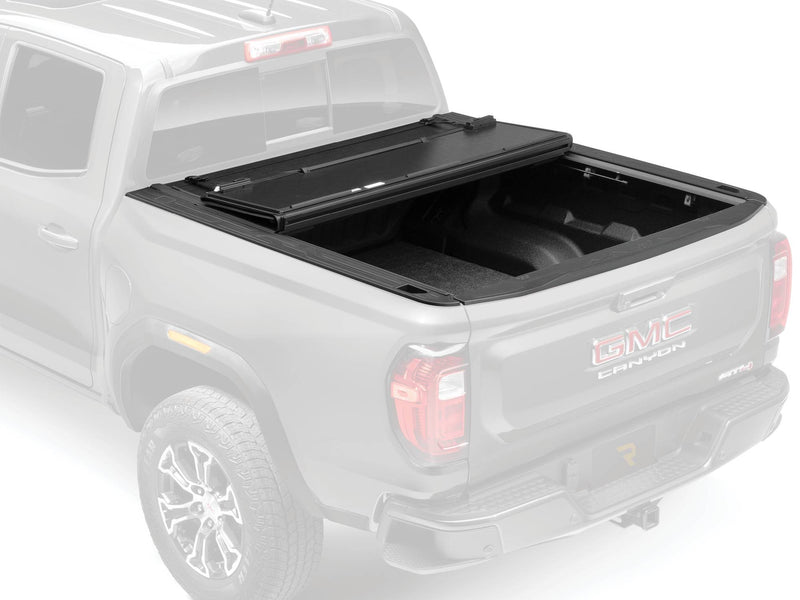 BAKFlip G2 hard folding tonneau cover folded forward to the cab, ghosted product view