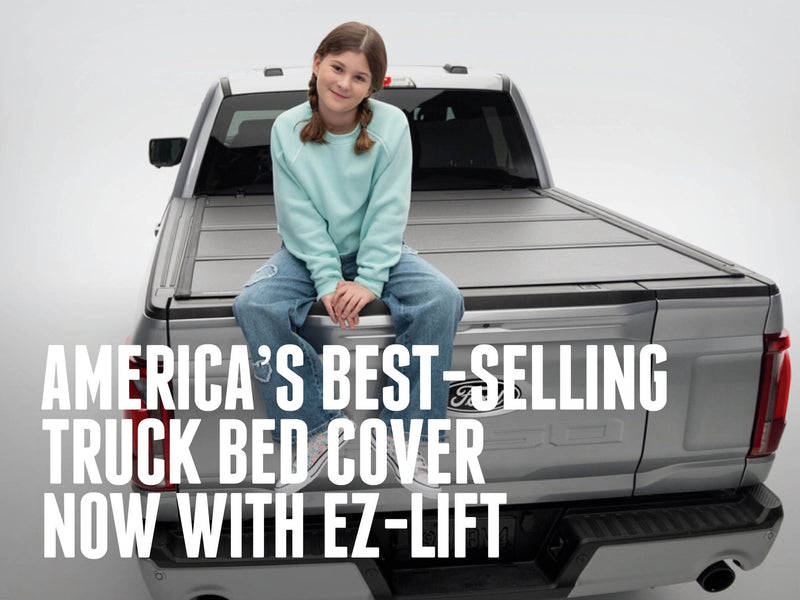 BAKFlip MX4 EZ-Lift closed and holding a person seated on the cover