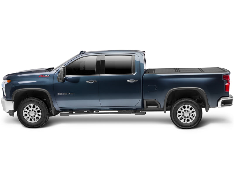 UnderCover Flex hard folding tonneau cover closed, full side profile of the bed showing the cover sitting flush with the bed rail line.