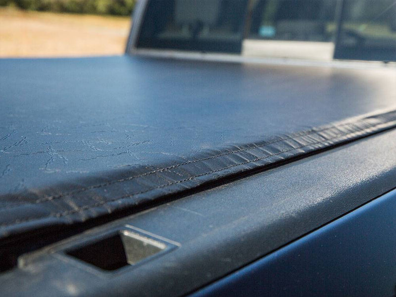 Close-up of the closed vinyl surface sealing over the side rail beside the stake pocket