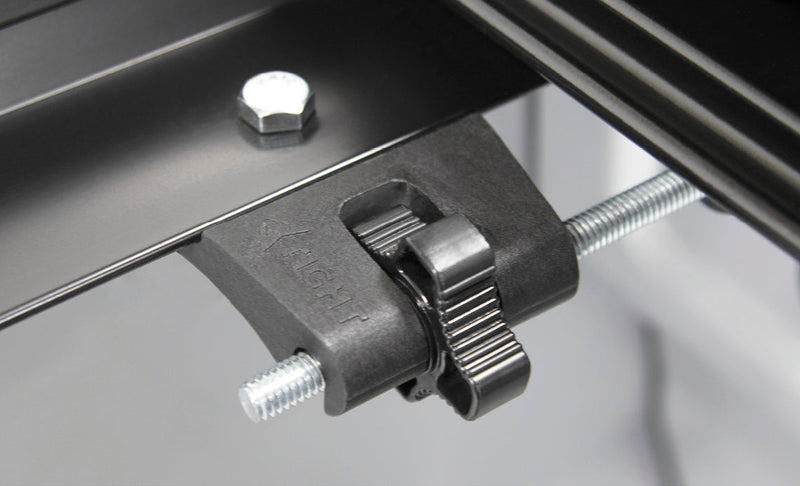 Studio close-up of the dial tension adjuster on the threaded rear rail rod