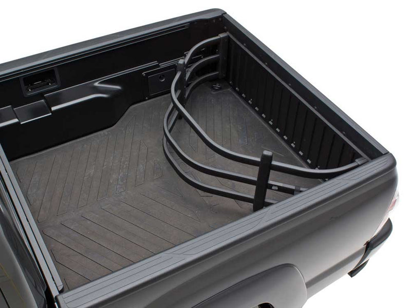 Black BedXTender HD Moto flipped inside the bed of a gray pickup against the closed tailgate, second angle