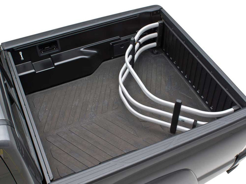 Silver BedXTender HD Moto flipped inside the bed of a gray pickup against the closed tailgate