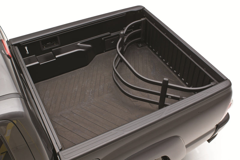 Black BedXTender HD Moto flipped inside the bed of a gray pickup against the closed tailgate