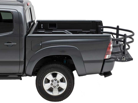 Gray crew-cab pickup in the studio with a black BedXTender HD Moto extended over the lowered tailgate