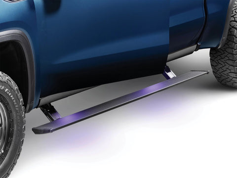 AMP Research PowerStep running board deployed below the cab doors with its step lights on