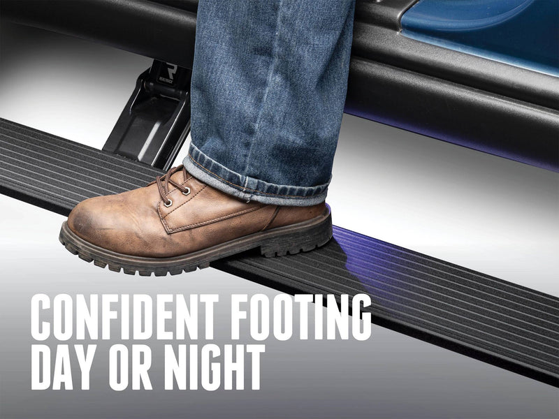 Work boot on the lit PowerStep with the text Confident Footing Day or Night