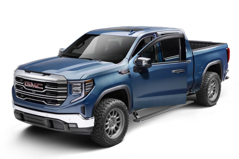 Blue crew-cab pickup in the studio with the running board deployed