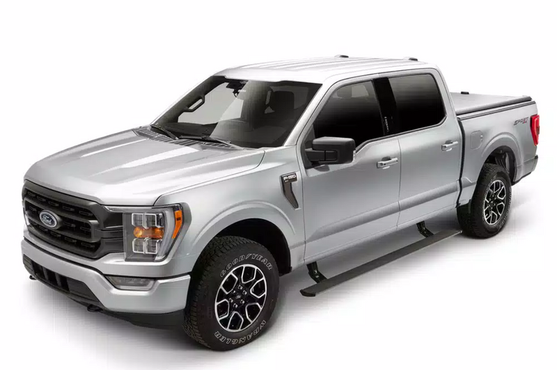 Silver crew-cab pickup in the studio with the running board deployed