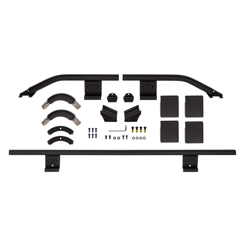 ARB BASE Rack front quarter guard rail kit laid out on white: rails, corner pieces, mounting brackets, pads and hardware