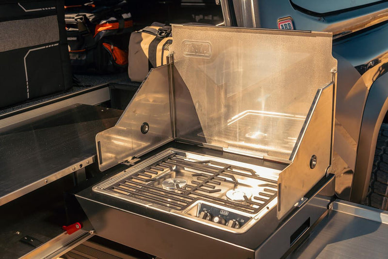 Close-up of the stove on an ARB slide-out camp kitchen deployed from a pickup