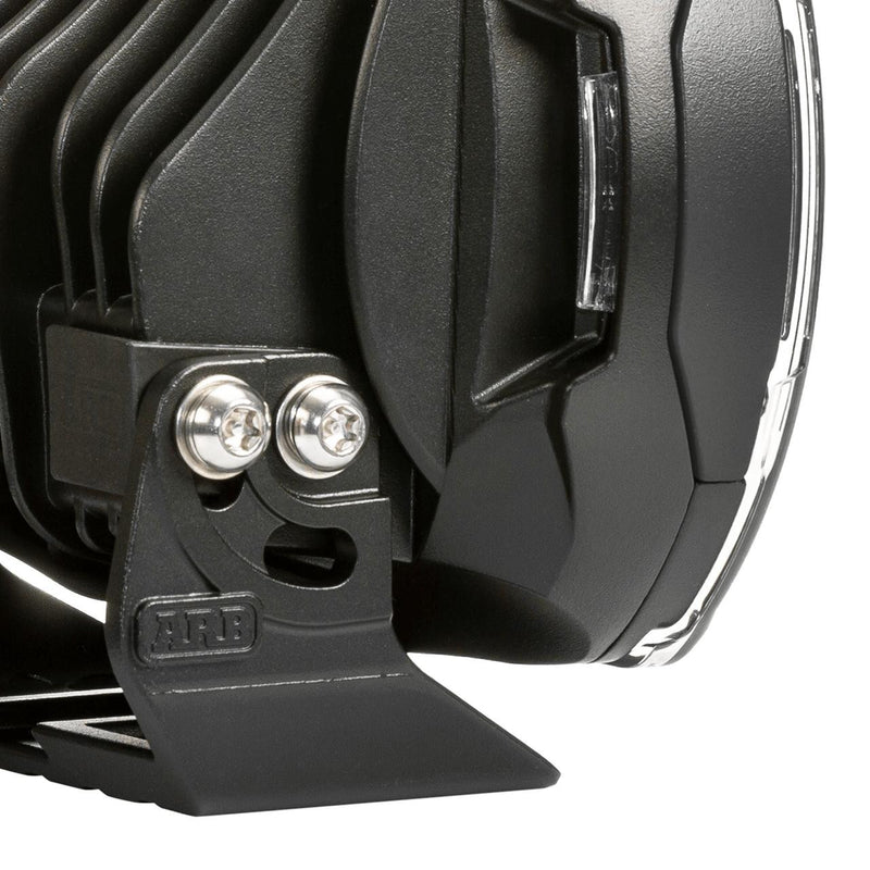 Close-up of the ARB Intensity SOLIS LED driving light stainless mounting bolts and bracket