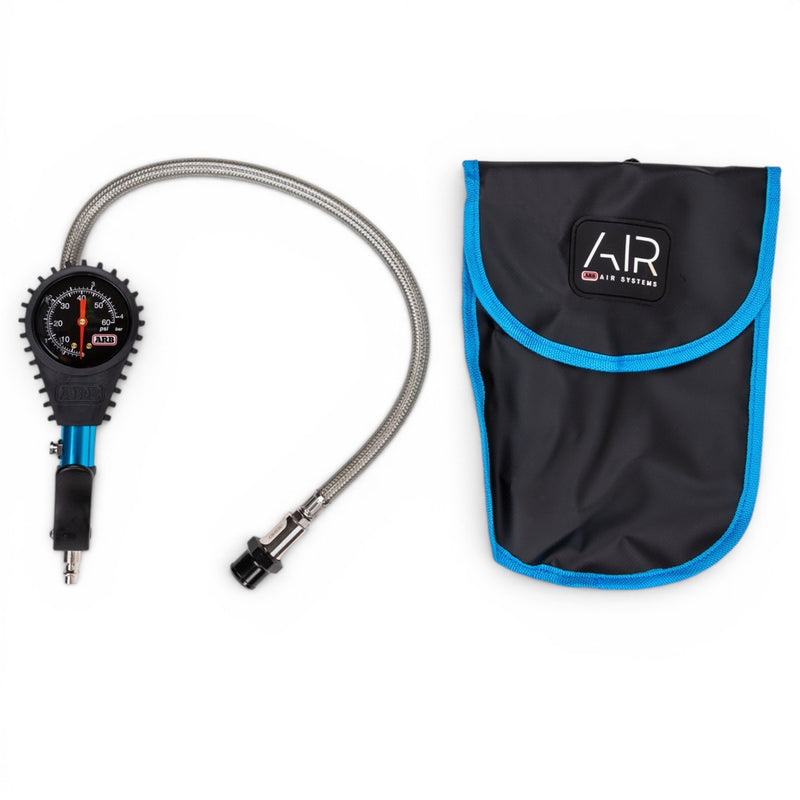 ARB analog tire inflator with braided hose and chuck beside its ARB Air Systems pouch on white