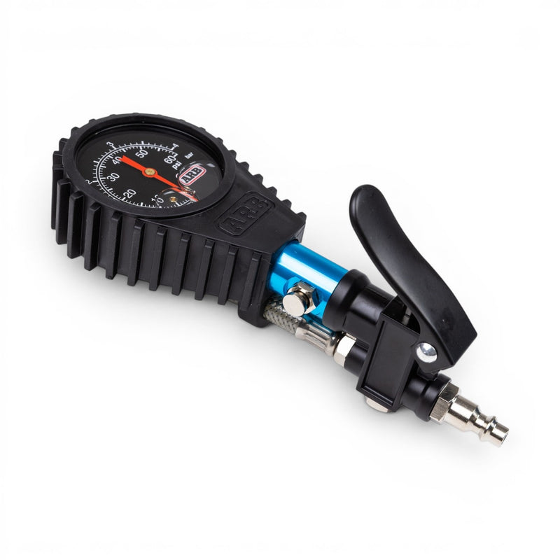 ARB analog tire inflator gauge with trigger lever and quick-connect plug, close-up