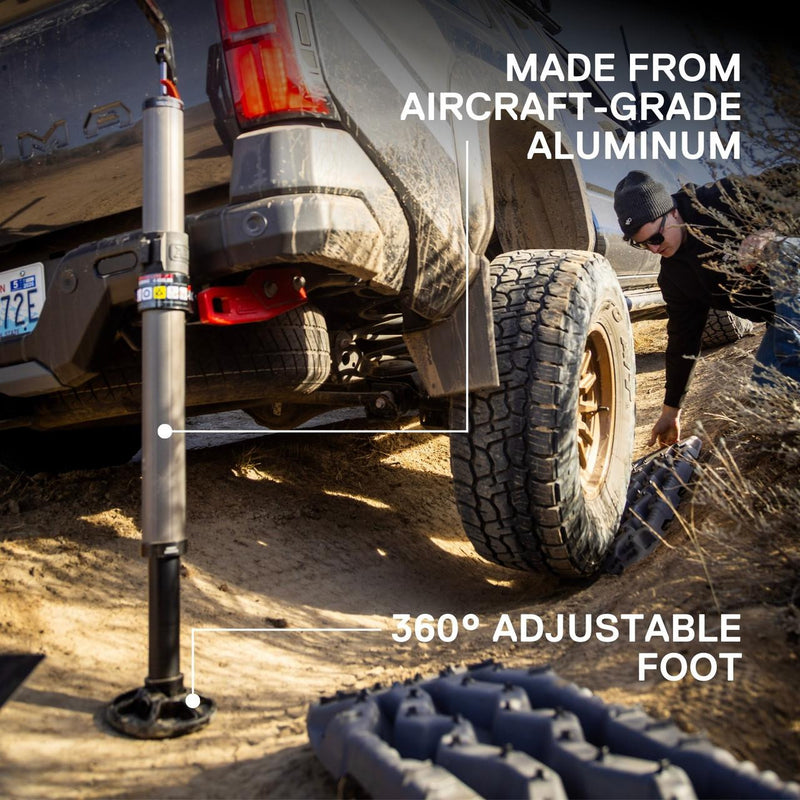 ARB JACK infographic beside a truck wheel, callouts for aircraft-grade aluminum and the 360 degree adjustable foot