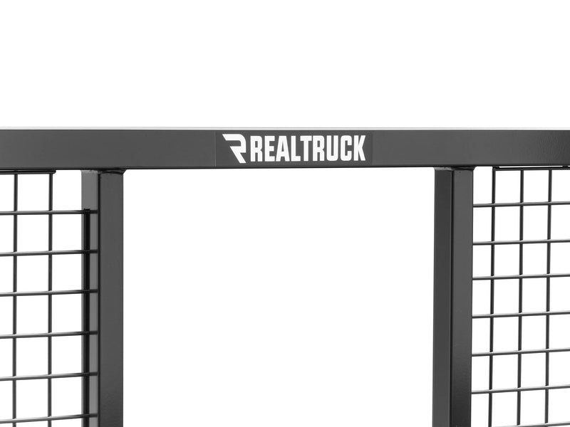 BackRack Half Safety: close crop of the top bar of a black half safety rack with welded mesh panels and a RealTruck decal