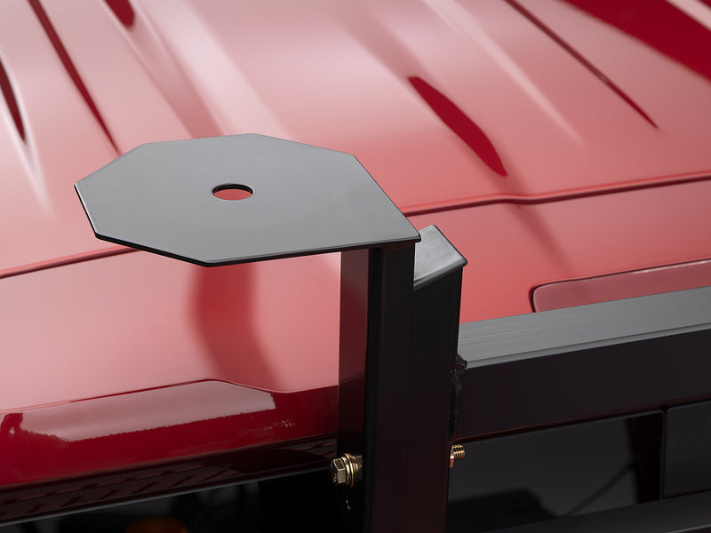 BackRack Light Brackets: an octagonal black light mounting plate stands on a post bracket beside a red cab roof