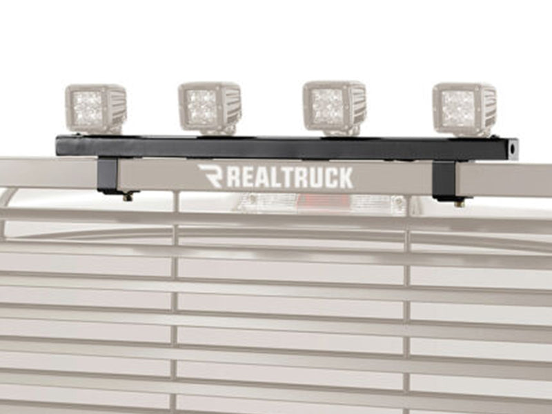 BackRack Light Brackets: black light bracket bar carrying four cube work lights on the top bar of a rack, with the rack faded to gray