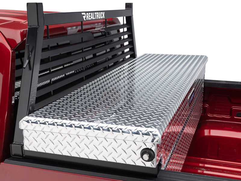 BackRack Louvered: A black louvered headache rack rises behind a diamond plate toolbox in a red pickup bed
