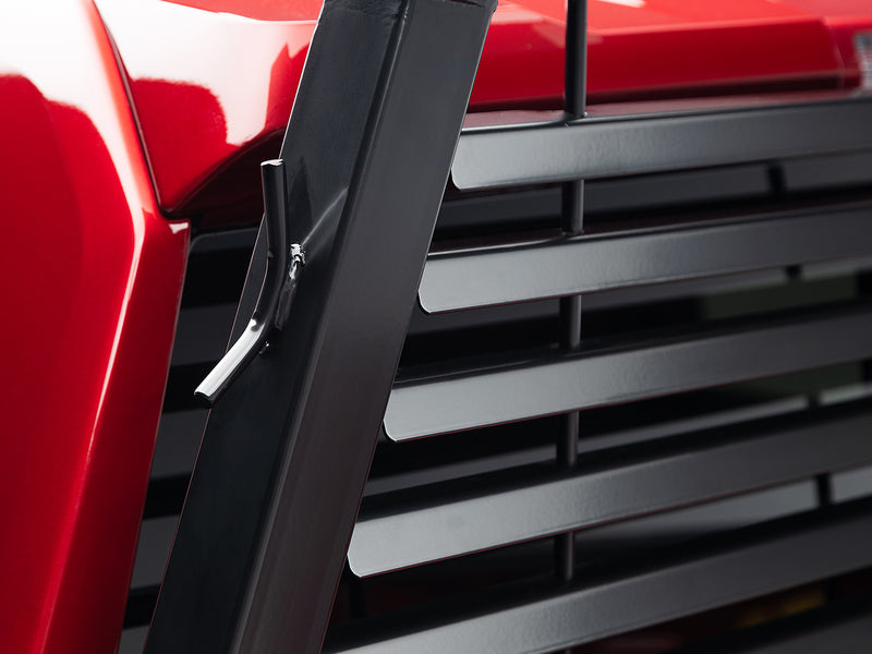 BackRack Louvered: close view of the side upright and steel louvers of a black louvered headache rack on a red pickup