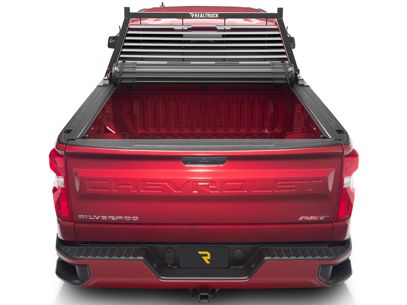 BackRack Louvered: rear view of a red pickup with a black louvered headache rack and a rolled tonneau cover