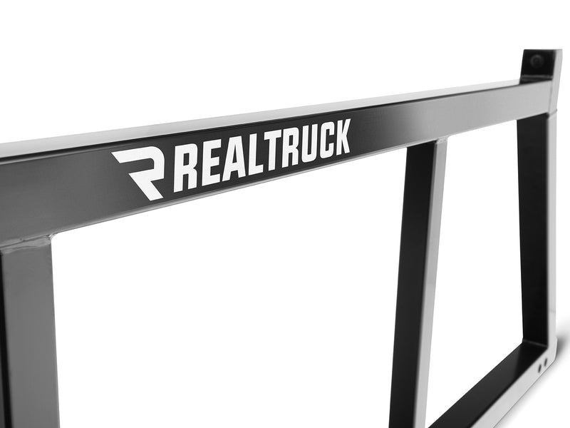 BackRack Open: close view of the top bar and upright of a black open headache rack