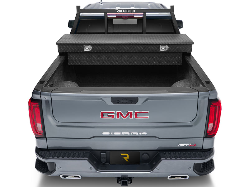 BackRack Open: rear view of a gray pickup with a black open headache rack behind a black crossover toolbox