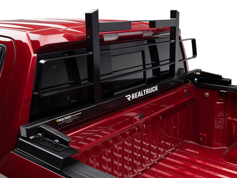 BackRack Original Short: black Original style headache rack on raised tonneau adapter brackets behind the cab of a red pickup
