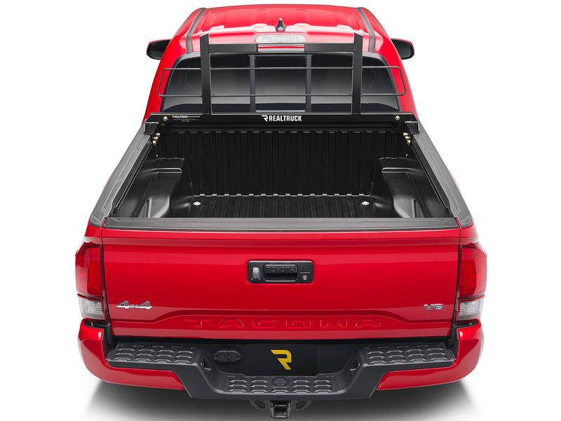 BackRack Original Short: rear view of a red pickup with a black Original style headache rack behind the cab and an empty bed