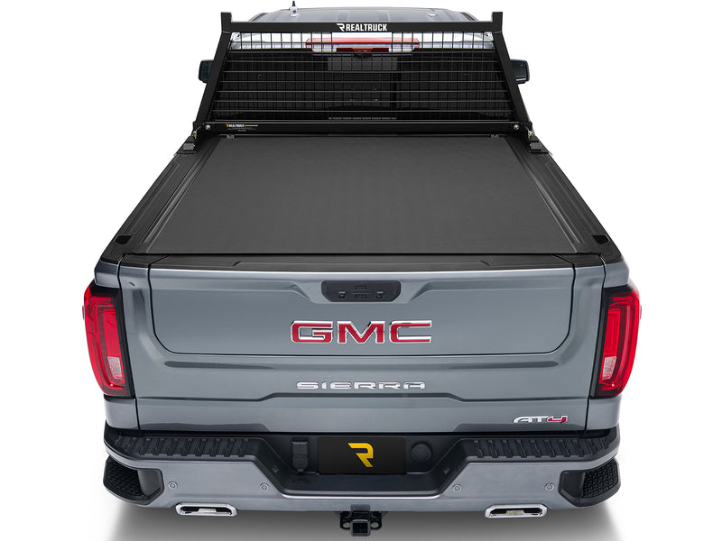 BackRack Safety: rear view of a gray pickup with a black Safety headache rack and a closed rolling tonneau cover
