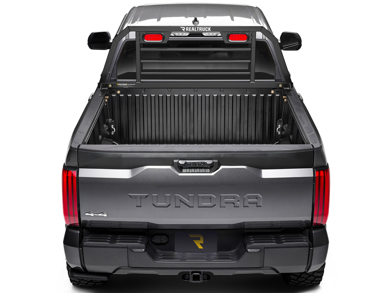 BackRack SRL: rear view of a gray Toyota Tundra with a black headache rack with red lights mounted at the front of the open bed