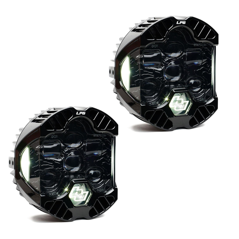 Baja Designs DOT LP6 LED Headlight Replacement Pair, whole product on a studio background: A pair of LP6 LED headlights with clear lenses and white accent lights glowing, on white