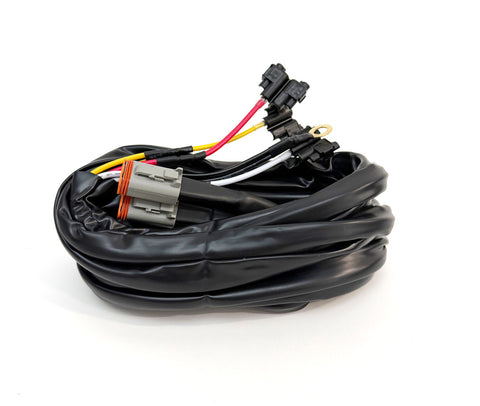 Baja Designs Dual Lead 4-pin Deutsch-style w/Hi/Low/Backlight Upfitter Harness, whole product on a studio background: A coiled dual lead harness with a gray Deutsch connector, relays and colored leads on white