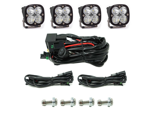 Baja Designs Squadron Pro Grille Light Kit, complete kit on a studio background: four Squadron Pro pods with clear lenses, a switch harness, two extension harnesses and four mounting bolts on white