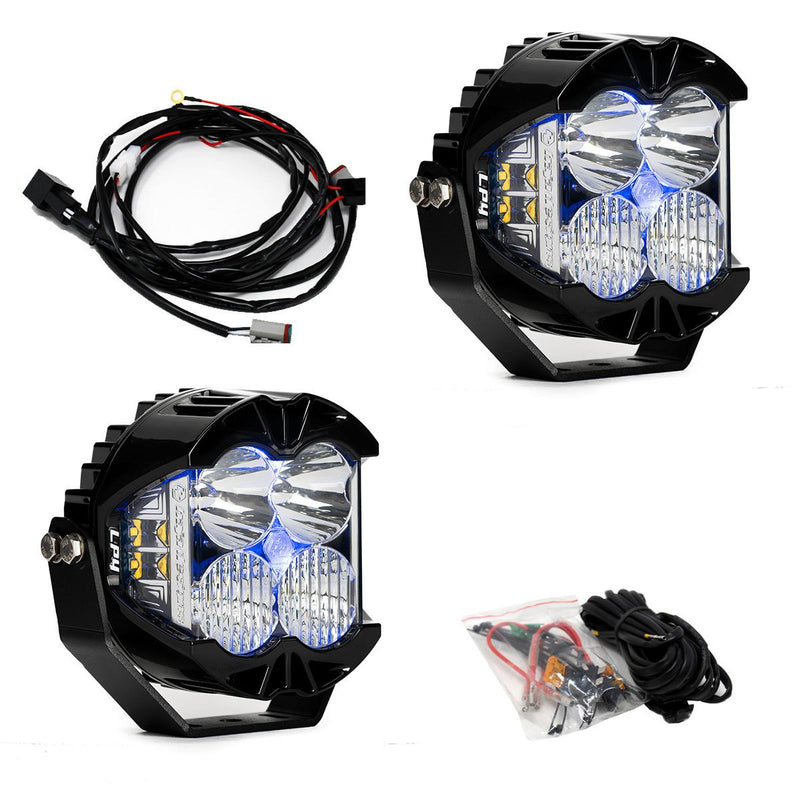 Baja Designs LP4 Pro LED Auxiliary Light Pod Pair, whole product on a studio background: A pair of LP4 Pro LED pods with clear lenses and blue backlights glowing, with a wiring harness and hardware bag on white