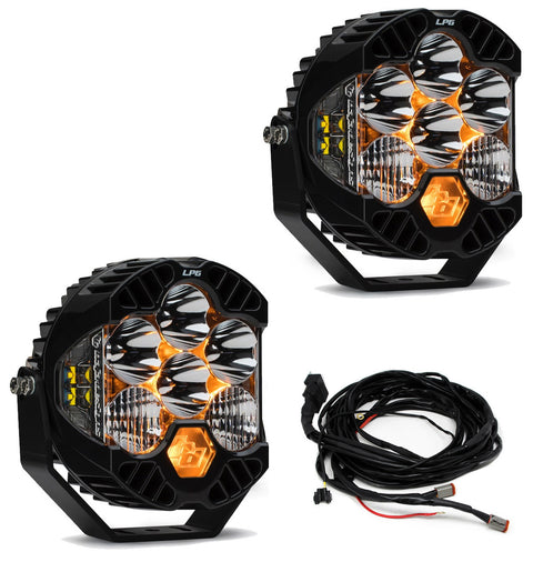 Baja Designs LP6 Pro Bumper Light Kit, complete kit on a studio background: two black LP6 Pro pods with clear lenses and amber backlight and a wiring harness on white