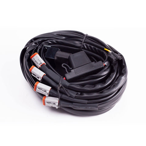 Baja Designs LP9, LP6, LP4 / Upfitter Wiring Harness, whole product on a studio background: A coiled wiring harness with four gray Deutsch connectors and an inline fuse holder on white