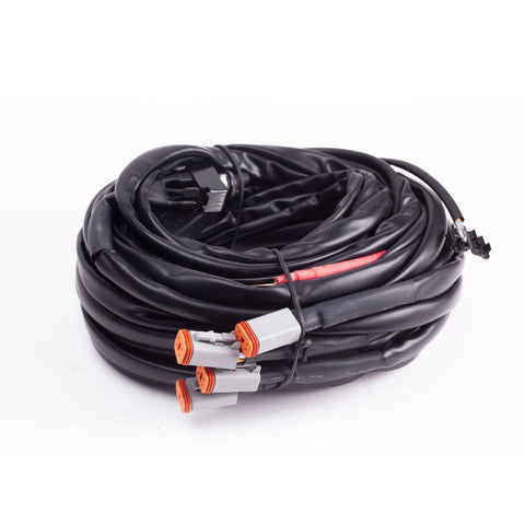 Baja Designs LP9, LP6, LP4 Wiring Harness, whole product on a studio background: A coiled wiring harness with four gray Deutsch connectors on white