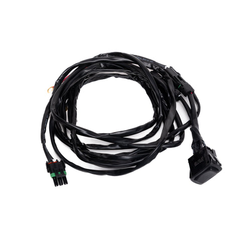 Baja Designs REFLEX Light Actuator Harness, Rocker Switch Universal Motor Actuator Adaptor Harness, whole product on a studio background: A looped black actuator harness with a weatherpack connector and a rocker switch on white
